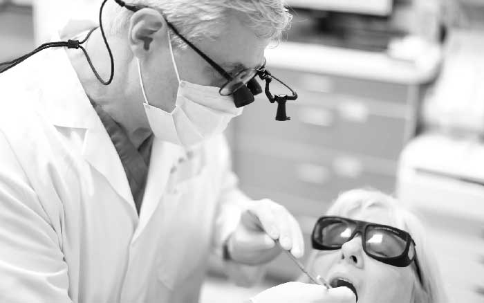 Dr. Eidelson Giving a Dental Cleaning