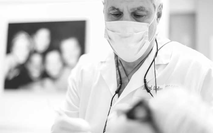 Dr. Eidelson Giving a Dental Examination