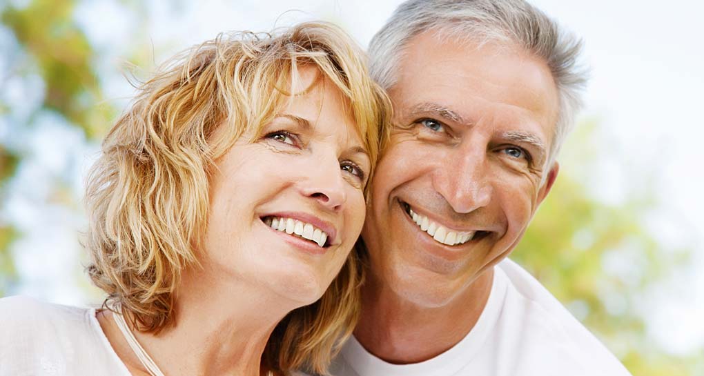 Smiling Couple With Dental Implants